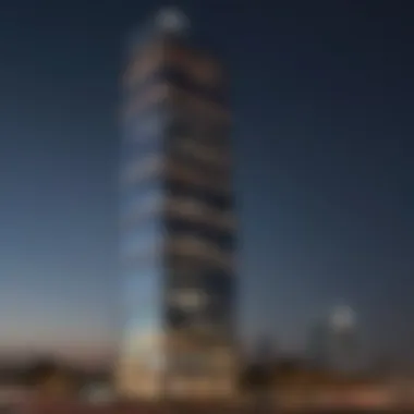 The Al Thuraya Tower illuminated at night, showcasing its architectural elegance.