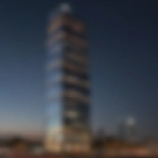 The Al Thuraya Tower illuminated at night, showcasing its architectural elegance.